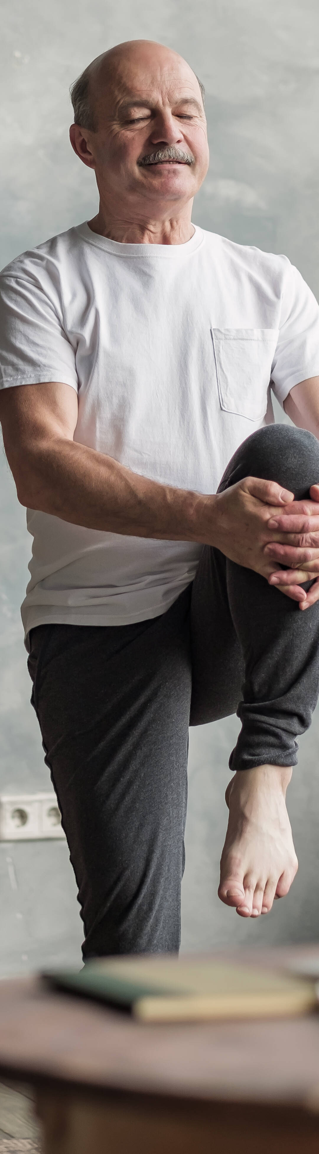 Senior,Handsome,Sportman,Doing,Stretching,And,Balancing,Yoga,Exercise,At